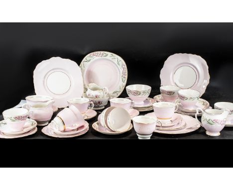 Colclough Pink Tea Service, in pink ground with floral decoration, comprising six tea cups, saucers and side plates, a large 