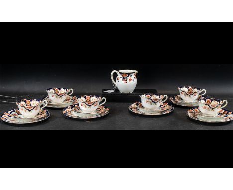 Suez Anchor China Tea Service, made in England.  Comprising six cups, saucers and side plates and matching milk jug.  White g