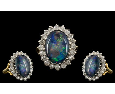 A 18ct Opal and Diamond Cluster Ring central black opal doublet, surrounded by 20 round modern brilliant cut diamonds, The op