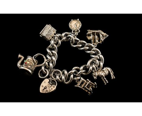 A Good Quality - Vintage Sterling Silver Charm Bracelet Loaded with 6 Quality Silver Charms. Both Curb Bracelet and Charms Ma