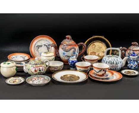 Collection of Oriental Porcelain, comprising a stone glazed teapot and lidded sugar bowl decorated with lizards, three cups, 