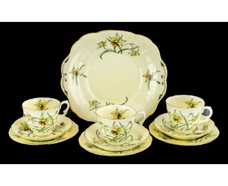 Staffordshire Crown Pottery Tea Service, in yellow ground decorated with daffodils, comprising six cups, saucers and side pla