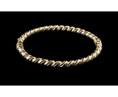 Ladies - Two-Tone 9ct Gold Hinged Bangle of Twist Design. Full Hallmark for 9ct. c.1980's. In As New Condition - Please Confi