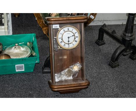 A William Widdop Wall Clock enamel chapter dial with Roman numerals, striking on a bell, glazed front. Height 20 inches. 