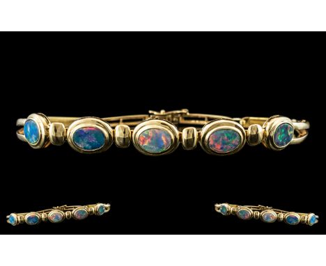 Ladies - 14ct Gold Attractive Opal Set Bracelet. Marked 585 - 14ct. The Five Opals of Good Colour, Est Weight 3.00 cts. Lengt