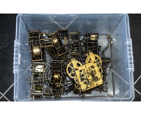 A Box Containing Nine Clock Movements, all for spares.