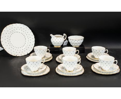 Royal Vale Bone China Tea Service, in white with small star print and gilt trim, comprising milk jug, sugar bowl, six trios o