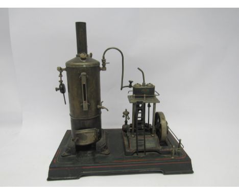 A Doll &amp; Cie live steam engine, the vertical brass boiler with cast firebox door, connected to overhead single cylinder a