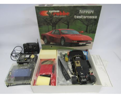 A part built System Robbe #3748 Ferrari Testarossa 1:10 scale remote control car model kit (contents unchecked), together wit