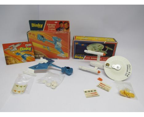 Two boxed Dinky Toys Star Trek diecast model space ships comprising 357 Klingon Battle Cruiser with photon missiles and sheet