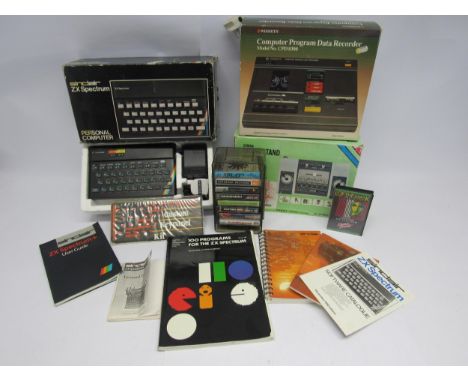 A boxed Sinclair ZX Spectrum Personal Computer with various games and software, custom keypanel kit, boxed WH Smith CPD 8300 
