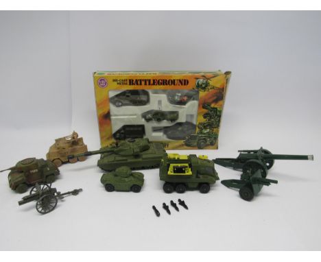 A boxed Zylmex diecast metal Battleground Adventure Playset, together with unboxed diecast military vehicles to include Dinky