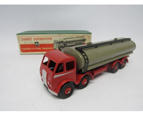 A boxed Dinky Supertoys diecast No. 504 Foden 14-Ton Tanker, red cab, chassis and ridged hubs, fawn tanker with black metal g