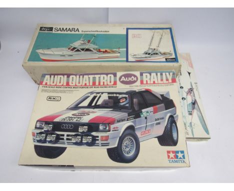 A boxed and unopened Top Flite rubber powered balsa wood Rascal 18 aeroplane model kit, together with Tamiya Audi Quattro Ral