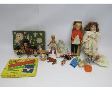 Assorted mid 20th Century and later dolls, together with a boxed doll's tea service and Spears crochet set 