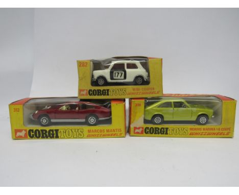 Three boxed Corgi Whizzwheels diecast model cars to include 282 Mini Cooper in white and black with racing number 177, 306 Mo
