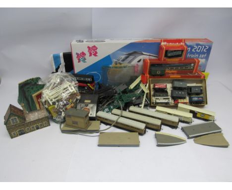 A collection of playworn loose and boxed 00 gauge model railway items including Hornby R1148 London 2012 train set box contai