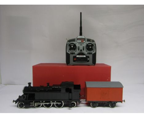 A boxed Bachmann Brassworks gauge 1 45XX 2-6-2 locomotive in black, with radio control fitted kit built box wagon and Spektru