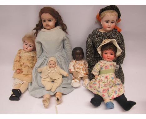 Five assorted bisque head dolls including Heubach Koppelsdorf, together with a large composition head doll on kid leather bod