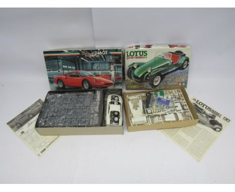 Two 1:24 scale sports car plastic model kits; Tamiya #2446 Lotus Super 7 Series II and Fujimi #16 Ferrari Dino 246GT (2, cont