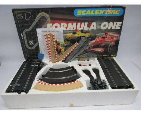 A boxed Scalextric Formula One Jordan Honda F1 vs Williams Renault FW20 slot racing set 