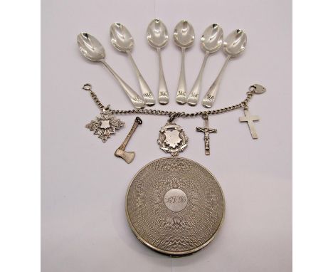 Group of silver comprising a 1940s engine turned compact, bracelet hung with two medal fobs and two crosses, plus further loo