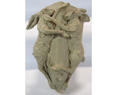 An unglazed clay wall planter with boxing hares in relief, signed Conolly  (Simon) 2012, 36cm x 20cm x 21cm. 