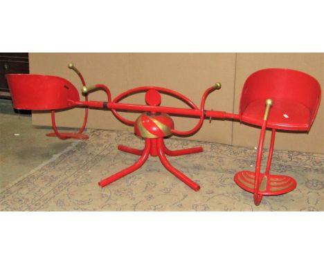 A refurbished vintage Merry go round for two children with over painted finish 