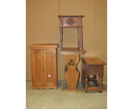 A small reproduction old English style oak box stool with hinged lid, together with an Arts &amp; Crafts style oak occasional