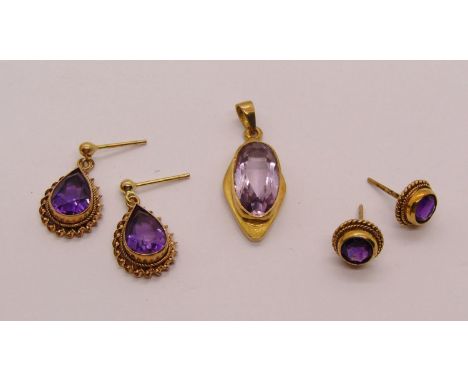 Group of 9ct amethyst jewellery comprising an Arts &amp; Crafts style pendant, maker 'W&amp;G', a pair of pear-cut drop earri
