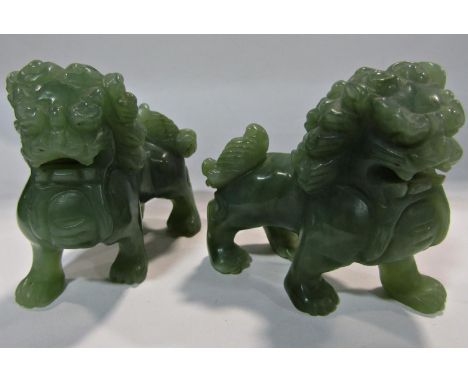 A pair of Chinese green jade lions, 7.5cm x 7cm high. 