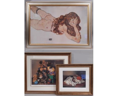Three framed prints: After Egon Scheile (1890-1918) - 'Female Nude Lying on Her Stomach', coloured print, 60 x 90 cm; Christi
