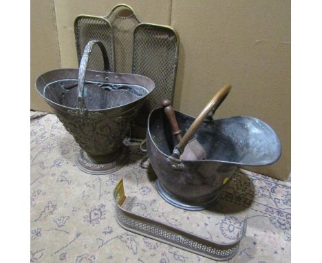 Two 19th century copper coal scuttles of varying size and design one with raised scrolling acanthus and mask detail, a small 