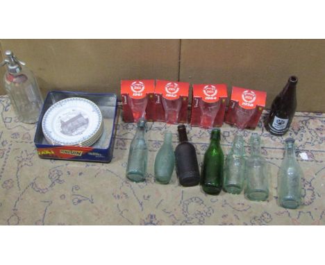 A small collection of vintage Stroud Brewery glass beer bottles, soda syphon, five limited edition ceramic plates, local inte