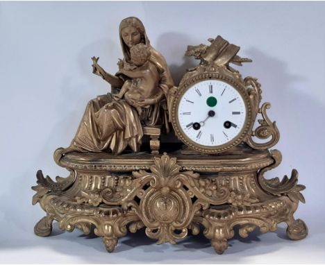 19th century gilt brass mantle clock, the decorative case showing mother and child with eight day striking movement 