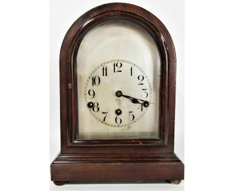 A mahogany bracket or shelf clock the domed case enclosing a German movement with silvered dial 33cm high