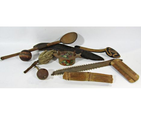 A miscellaneous collection of items including a model of a Native American silver birch canoe, a saw fish blade, wooden knit 