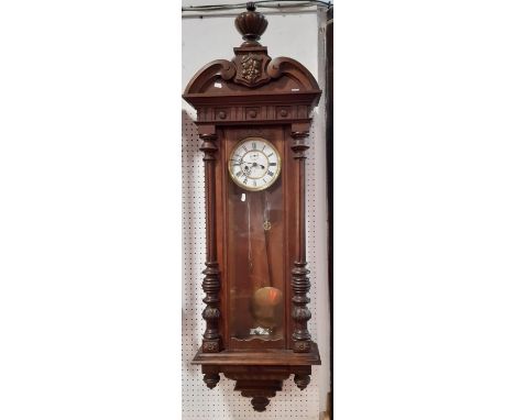 A 19th century oak cased Vienna style wall clock with twin train weight driven movement by Gustav Becker 