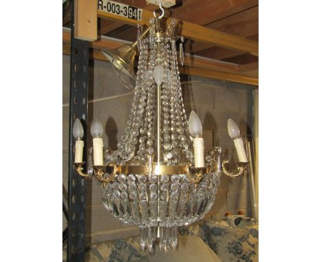 A six branch chandelier in brass and cut glass approx height 70 cm plus chain, 60 cm diameter 