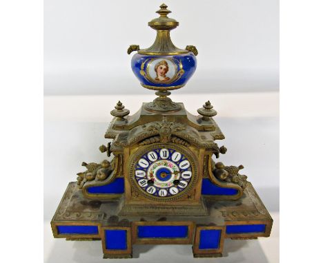 A Victorian gilt brass and porcelain panelled mantel clock with eight day striking movement 