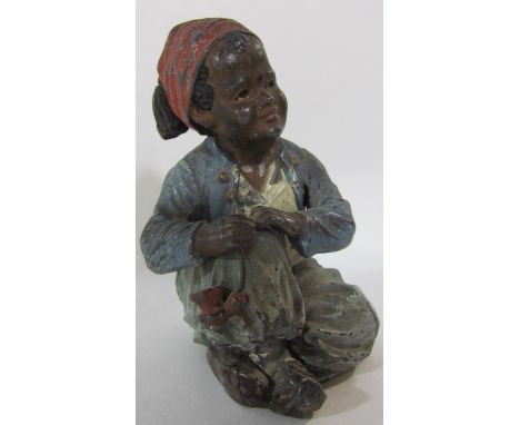 An Austrian 19th century cold painted Arab boy smoking a pipe, 8cm tall. 