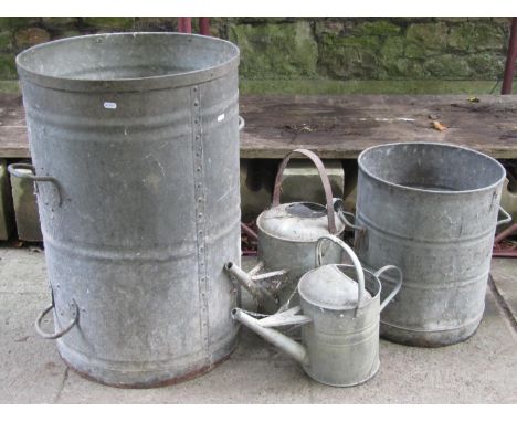 A vintage cylindrical galvanised sanitary dustbin with four fixed loop handles  53 cm diameter x 79 cm high together with a s