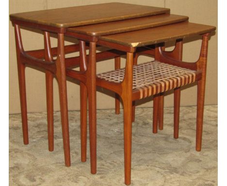 A nest of three retro Danish teak occasional tables raised on moulded tapered supports, smallest example with interwoven spli