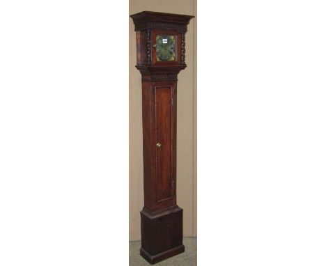 An early 20th century oak grandmother clock  155 cm high  enclosing a square six inch brass dial 
