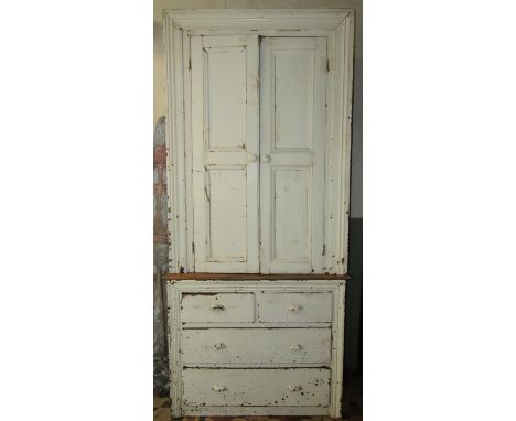 A rustic antique pine two sectional alcove housekeepers cupboard with painted finish and moulded surround, 117 cm wide x 51 c