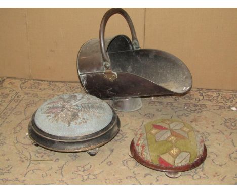 A 19th century copper helmet shaped coal scuttle together with a cast iron fire grate, pair of Victorian circular footstools 