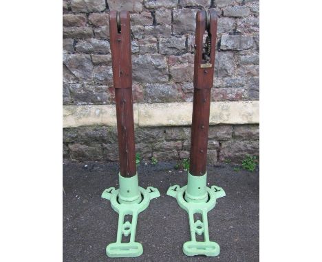 A pair of F A Davis Ltd London vintage lawn tennis posts in oak and cast iron 