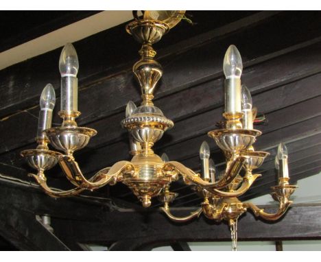 A pair of good quality polished cast metal five branch electroliers and matching two branch wall light 