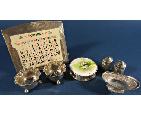 A silver engine turned desk top calendar with a complete set of ivorine week and month plates, Birmingham 1933, maker Deakin 