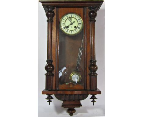 A 19th century Vienna wall clock by Gustav Becker within a decorated case 